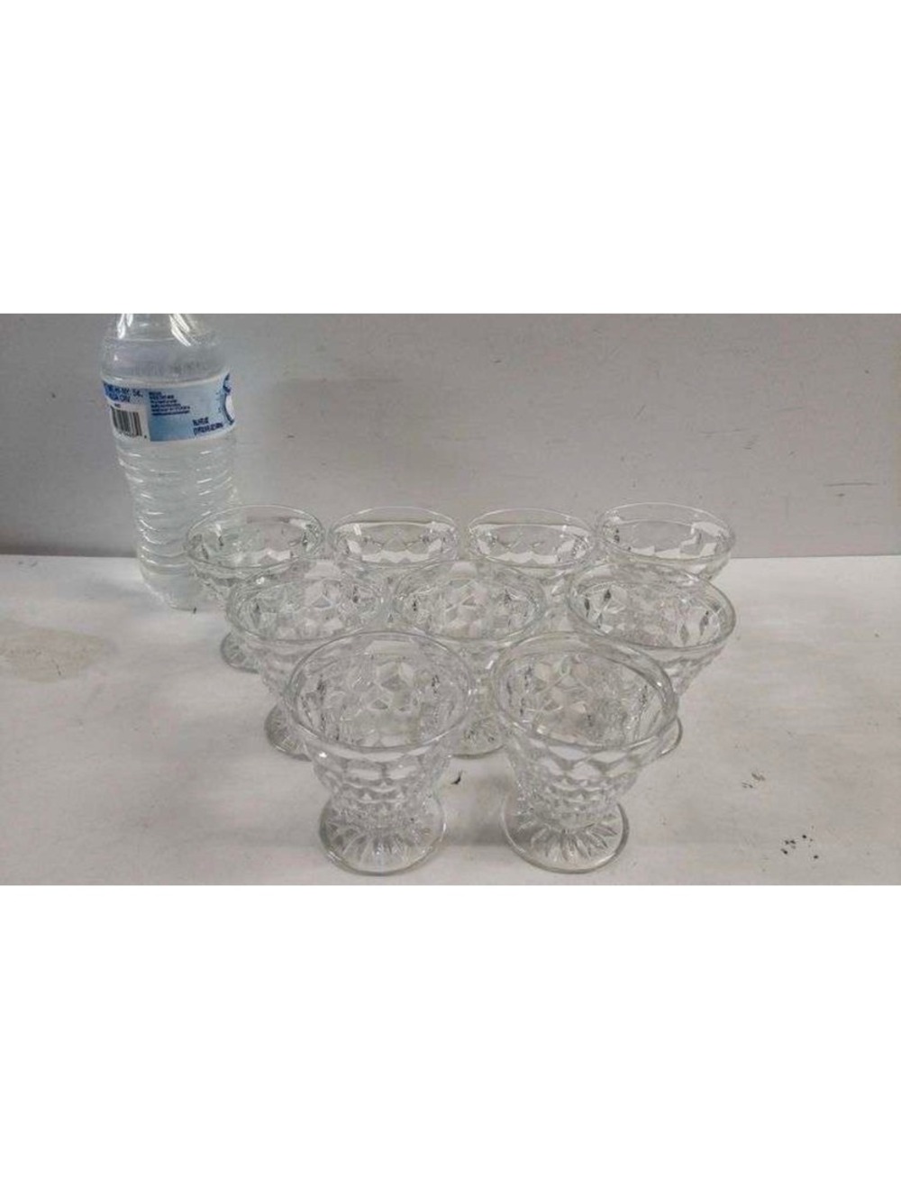 Clear pressed glass footed tumblers set